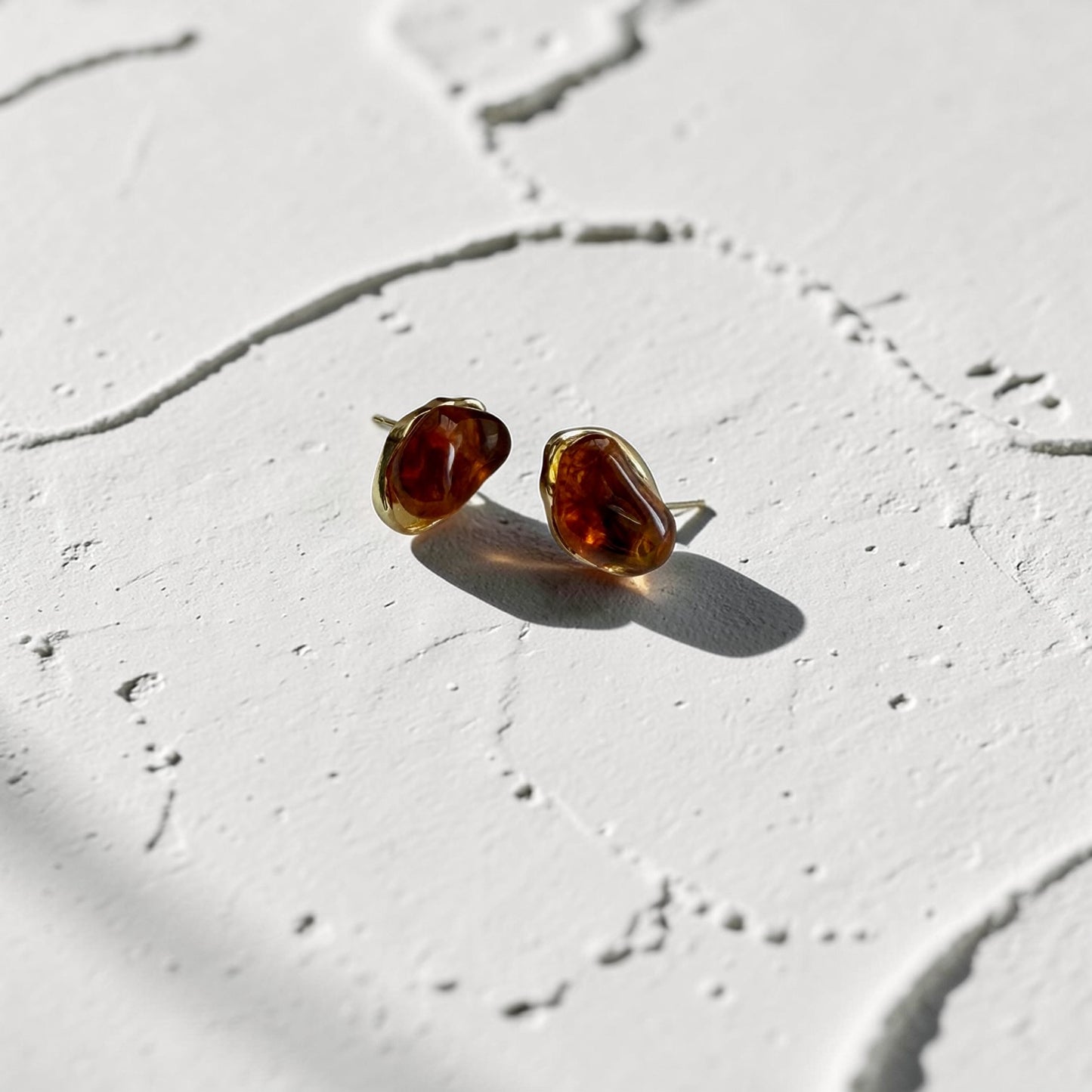 Organic Amber Resin Stud Earrings S925 Gold Wavy — pair shown together on flat lay