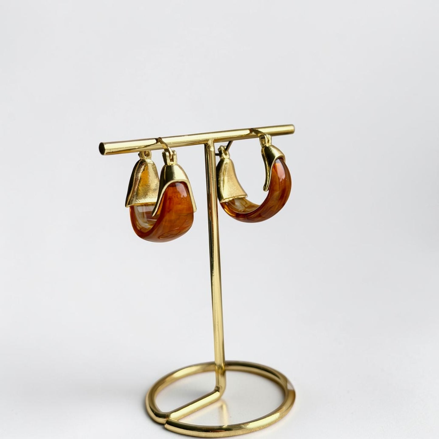 Amber Tortoiseshell Resin Chunky Hoop Drop Earrings — detail shot of gold tone