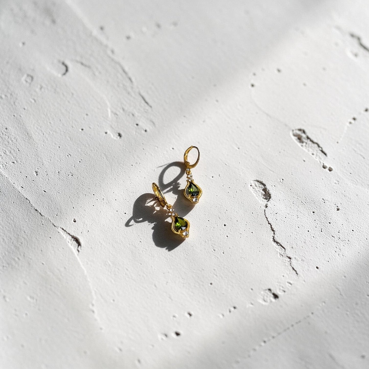 Olive Green Crystal Huggie Drop Earrings Gold Tone — styled with neutral outfit