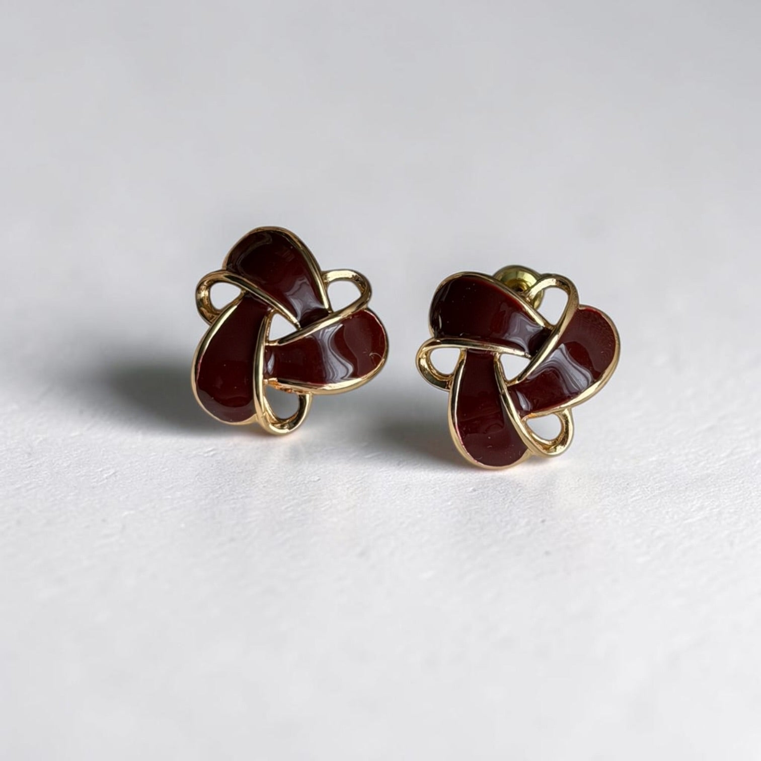 Burgundy Enamel Knot Stud Earrings S925 Gold Tone — angle highlighting drop and movement