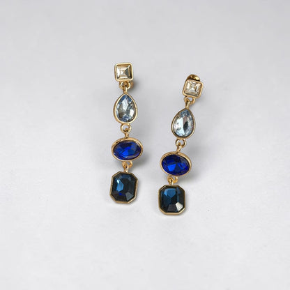 Sapphire Blue Four-Stone Drop Earrings Gold Tone — styled with neutral outfit