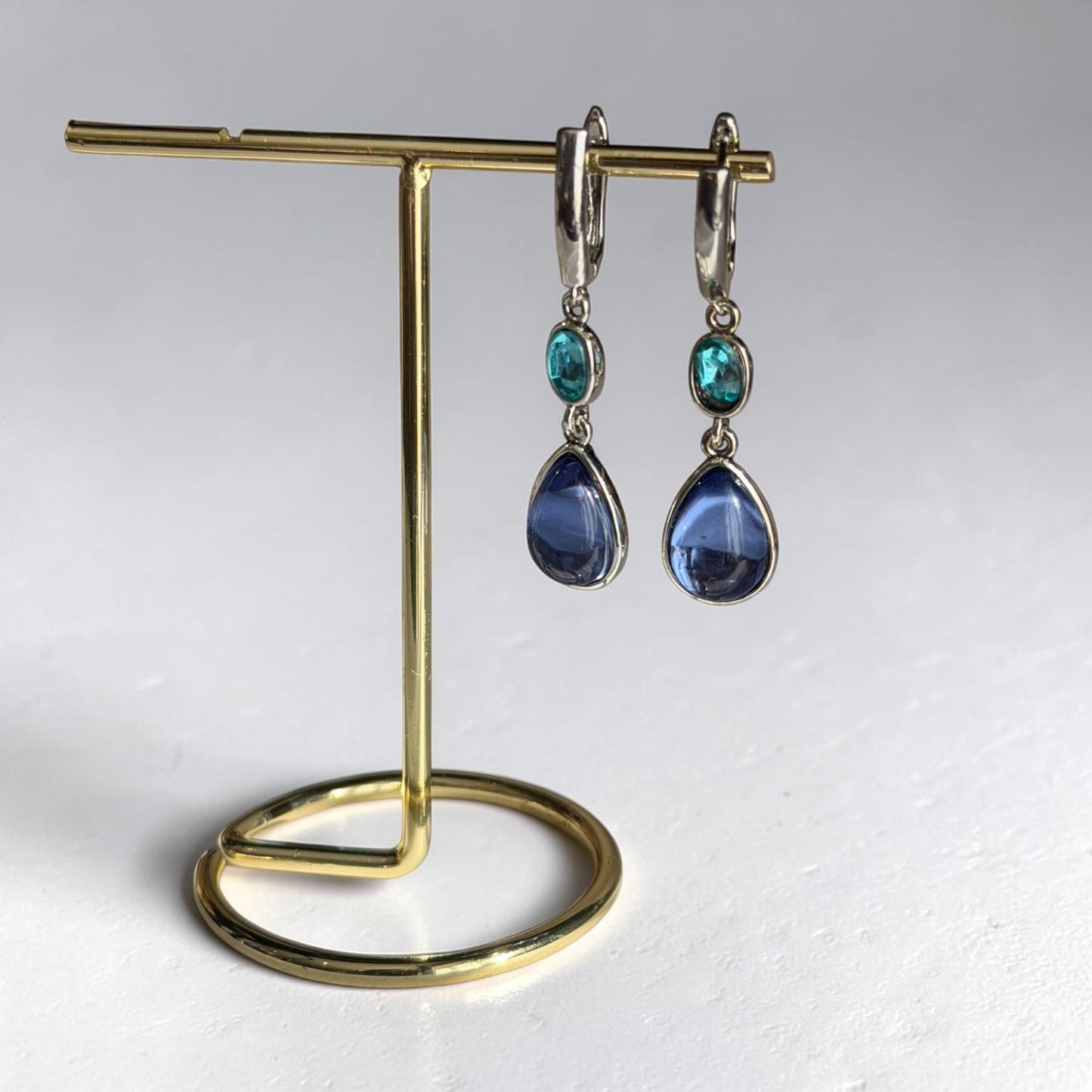Teal & Blue Dual Crystal Drop Earrings Silver Tone — angle highlighting drop and movement