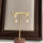 Freshwater Pearl Floral Stud Earrings S925 Gold on neutral background — front view