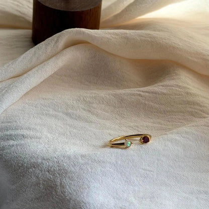 Minimalist Red Stone Ring 18K Gold Adjustable Band — worn on finger, angled view
