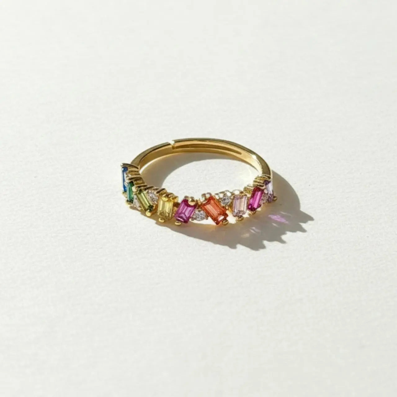 Rainbow Baguette Stone Eternity Ring Gold Women — styled flat lay