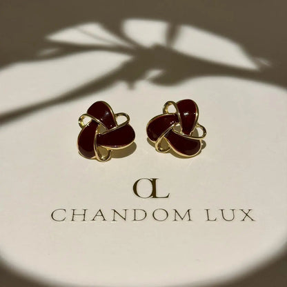 Burgundy Enamel Knot Stud Earrings S925 Gold Tone on neutral background — front view