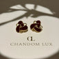 Burgundy Enamel Knot Stud Earrings S925 Gold Tone on neutral background — front view