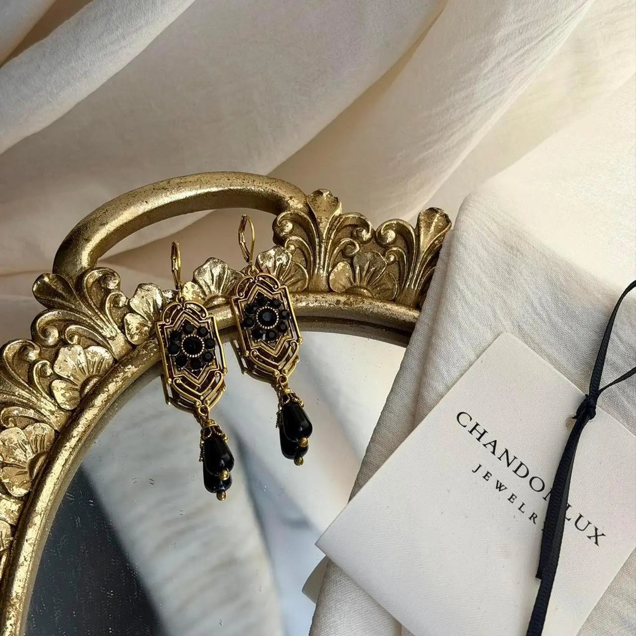 Art Deco Black Crystal Filigree Drop Earrings Gold — worn on model, side profile