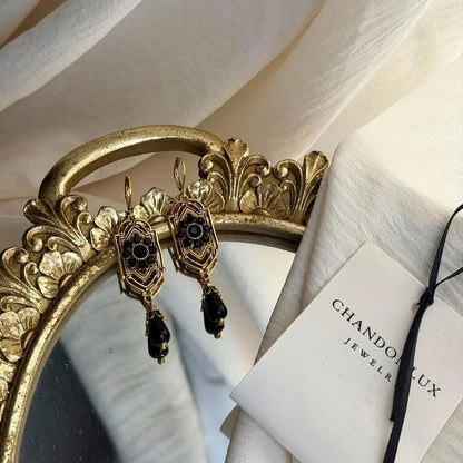Art Deco Black Crystal Filigree Drop Earrings Gold — worn on model, side profile