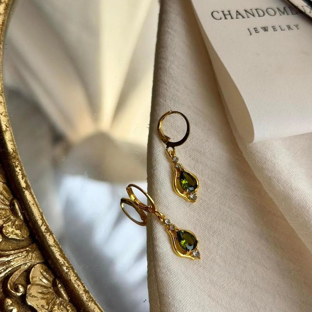 Olive Green Crystal Huggie Drop Earrings Gold Tone — close-up of pearl and post detail