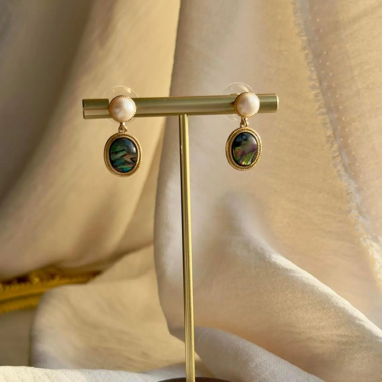 Abalone Shell & Freshwater Pearl Drop Earrings Gold — worn on model, side profile