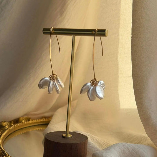 Clear Petal Cluster Drop Earrings Gold Tone Alloy on neutral background — front view