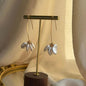 Clear Petal Cluster Drop Earrings Gold Tone Alloy on neutral background — front view