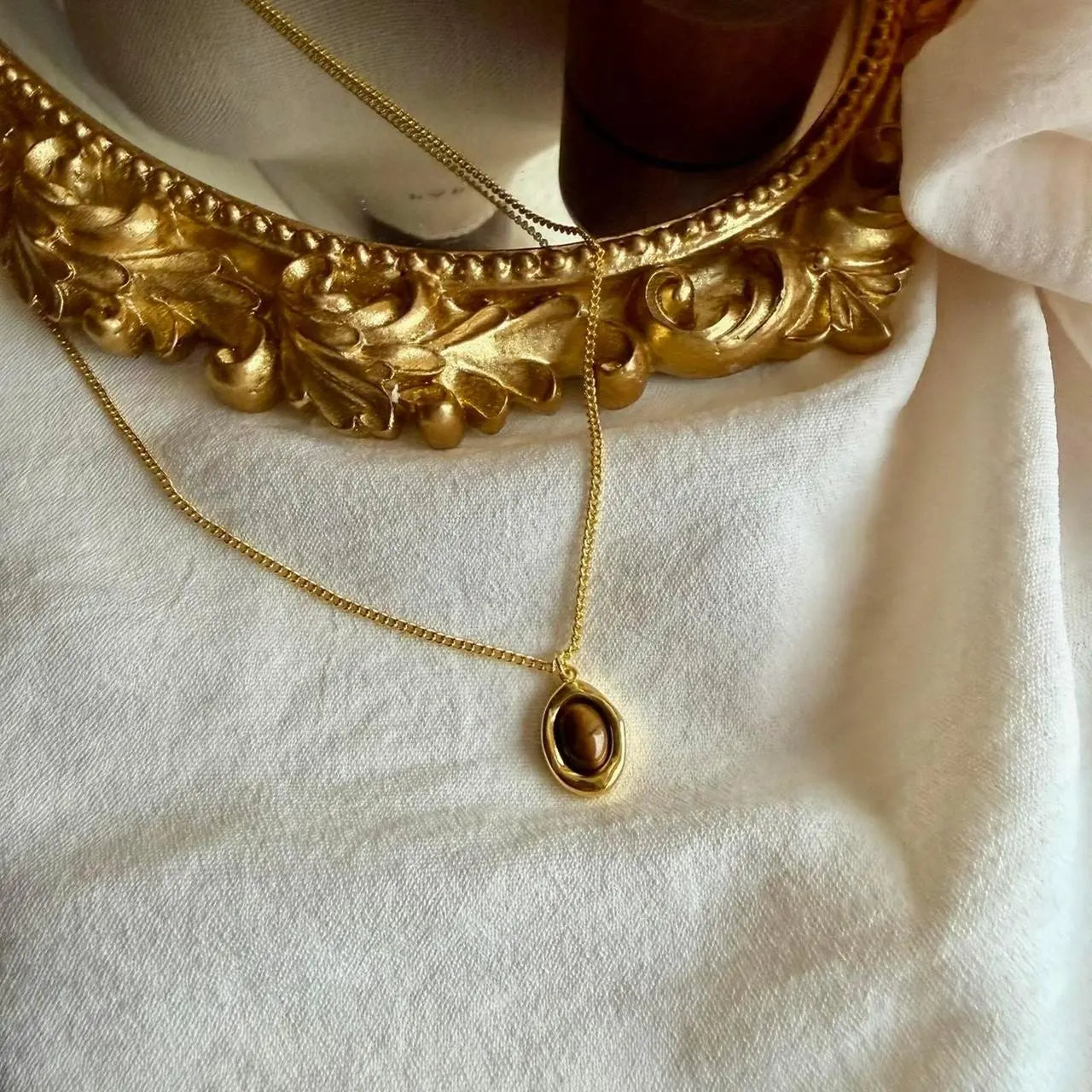 Natural Tiger Eye Oval Pendant Necklace Gold Plated — worn on model