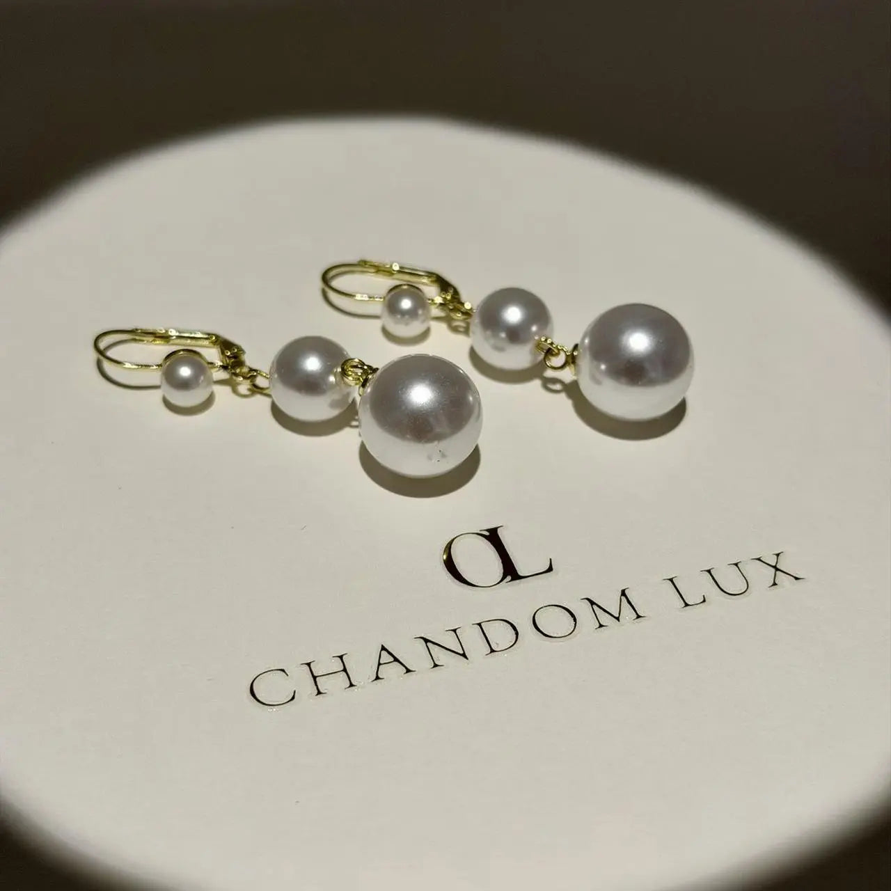 Triple Graduated Pearl Drop Earrings S925 Gold — angle highlighting drop and movement