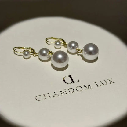 Triple Graduated Pearl Drop Earrings S925 Gold — angle highlighting drop and movement