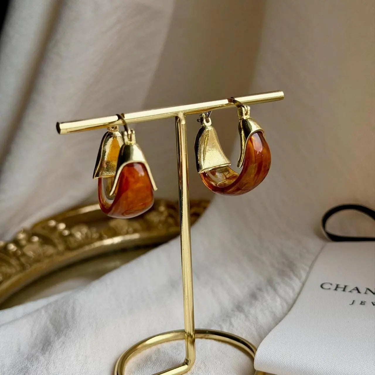 Amber Tortoiseshell Resin Chunky Hoop Drop Earrings — close-up of pearl and post detail