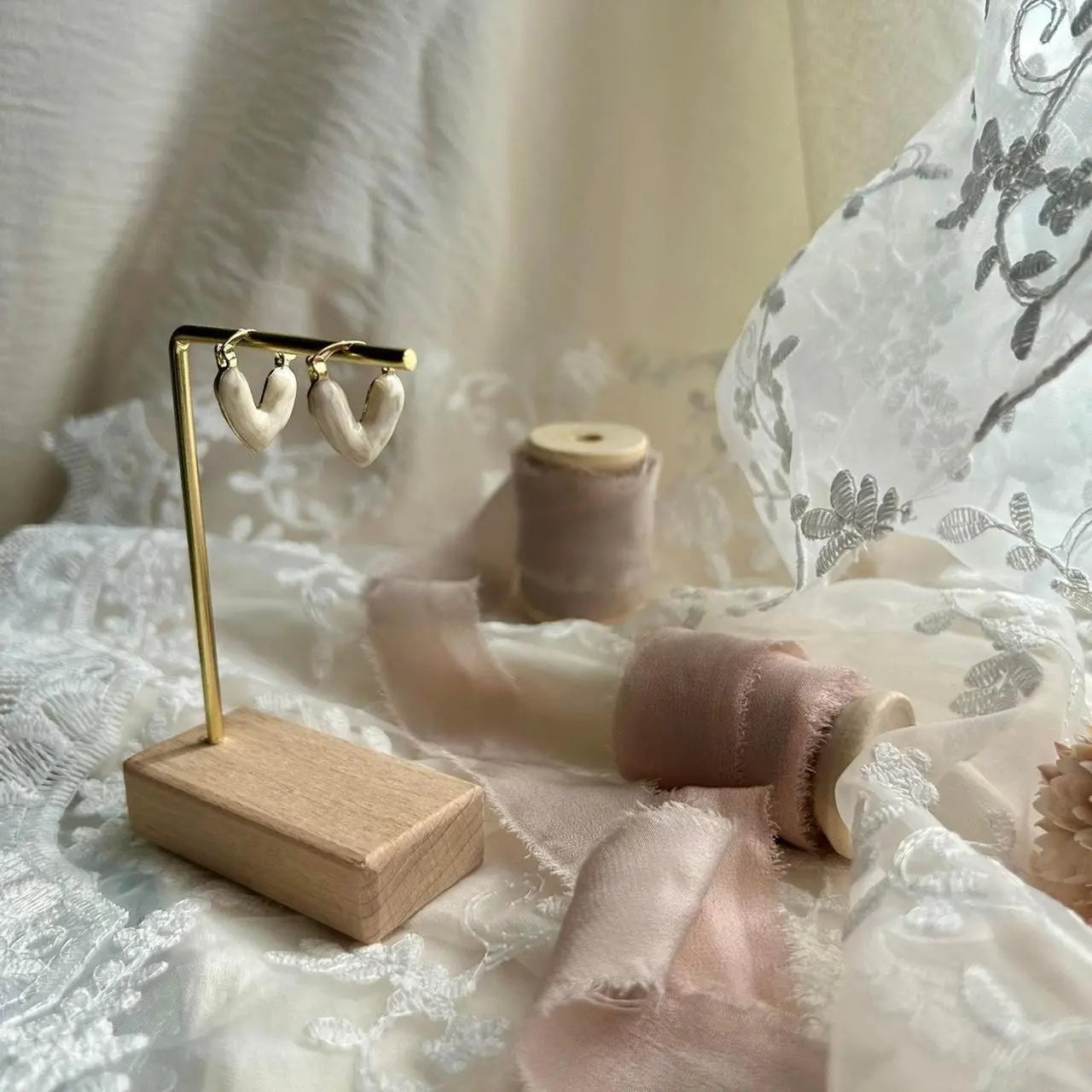 Cream Heart Drop Earrings Gold Romantic Women — worn on model, side profile