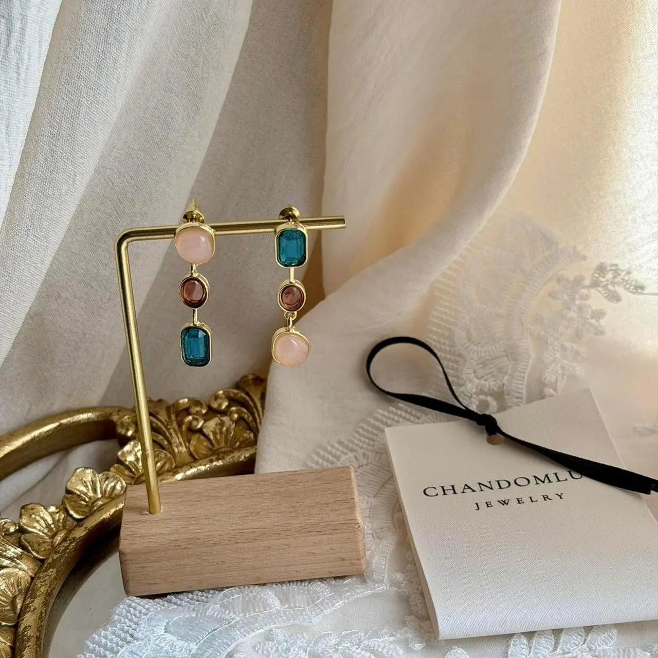 Asymmetric Triple Stone Cascade Drop Earrings S925 — worn on model, side profile