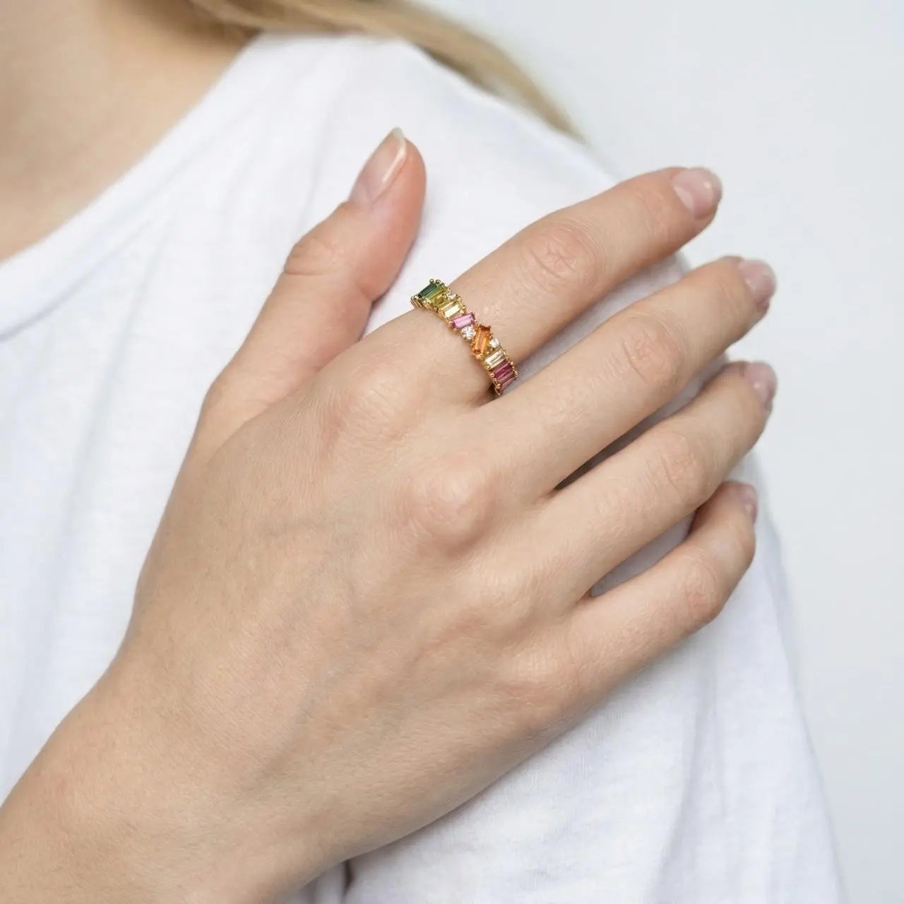 Rainbow Baguette Stone Eternity Ring Gold Women on neutral background — front view