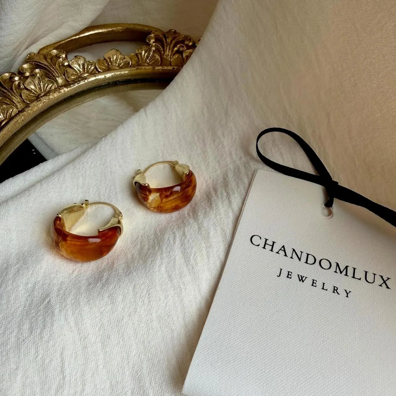 Amber Tortoiseshell Resin Chunky Hoop Drop Earrings — angle highlighting drop and movement