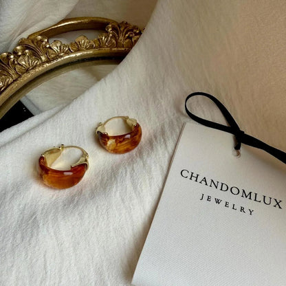 Amber Tortoiseshell Resin Chunky Hoop Drop Earrings — angle highlighting drop and movement