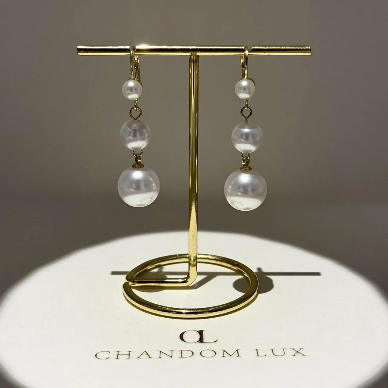 Triple Graduated Pearl Drop Earrings S925 Gold — close-up of pearl and post detail