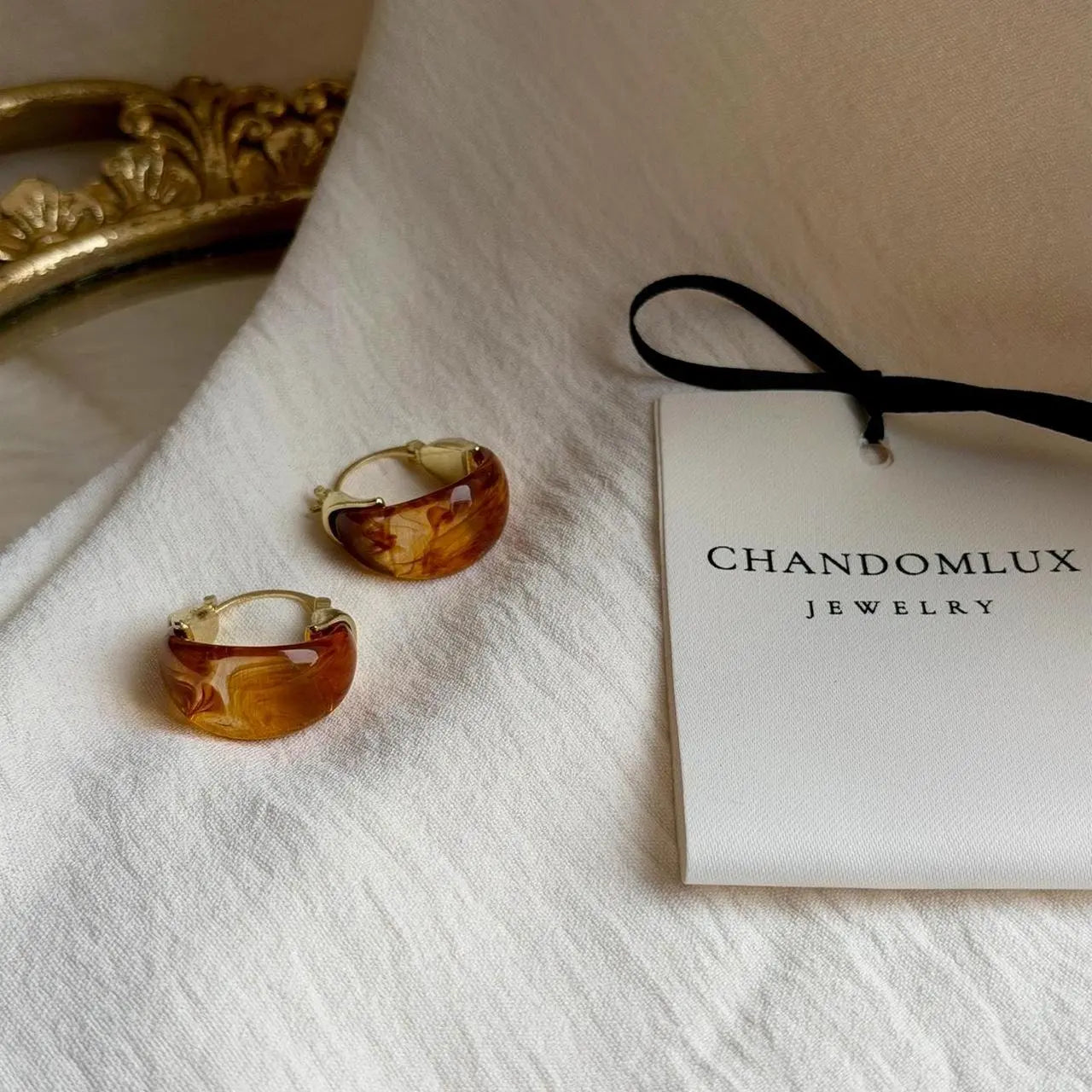Amber Tortoiseshell Resin Chunky Hoop Drop Earrings — styled with neutral outfit