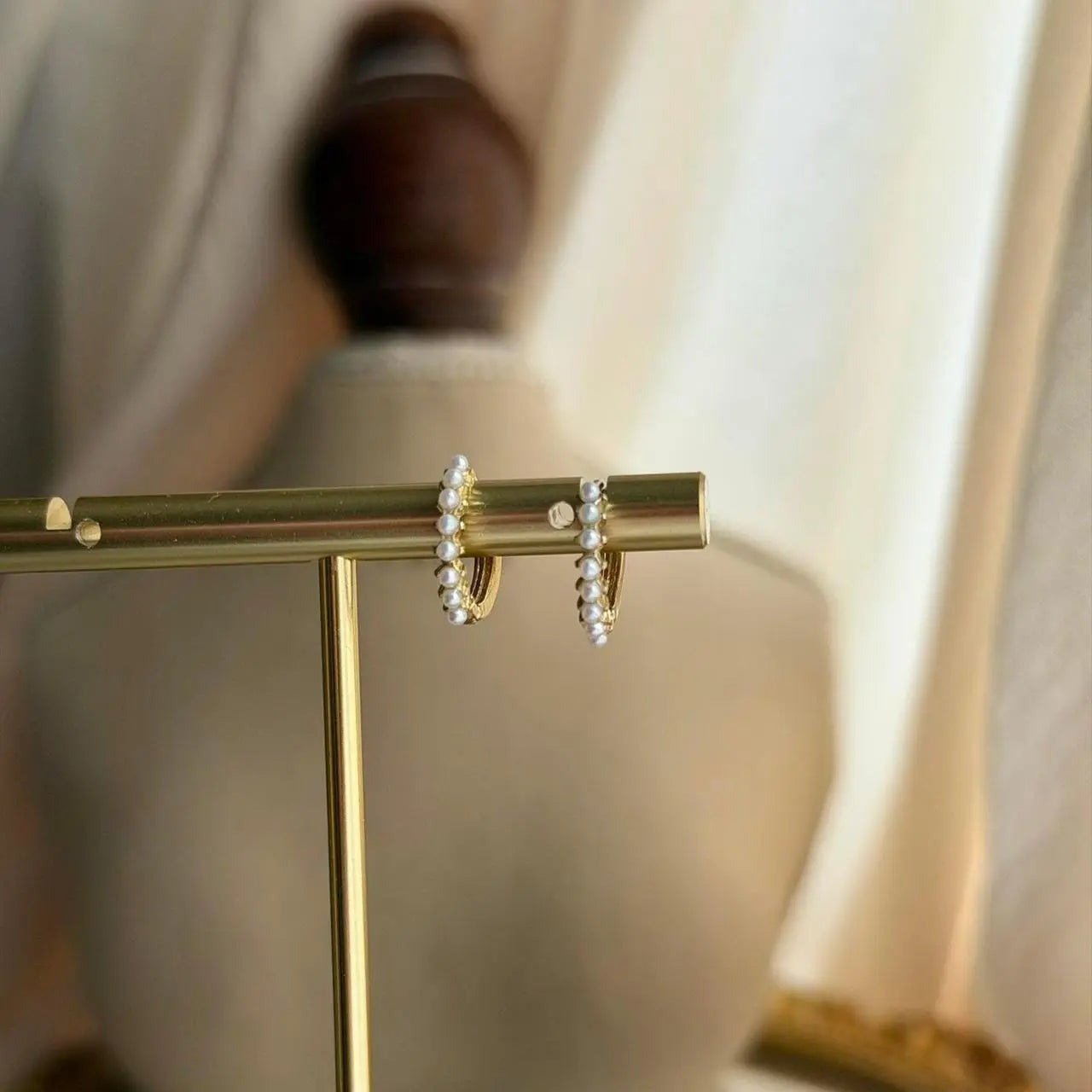 Mini Pearl Studded Huggie Hoop Earrings S925 Gold on neutral background — front view