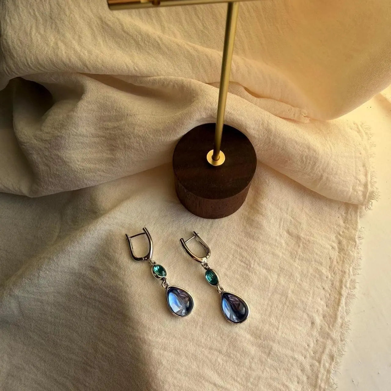 Teal & Blue Dual Crystal Drop Earrings Silver Tone — worn on model, side profile
