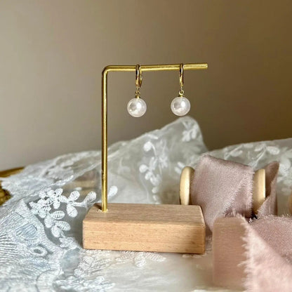 Pearl Drop Huggie Hoop Earrings S925 Silver Gold — worn on model, side profile