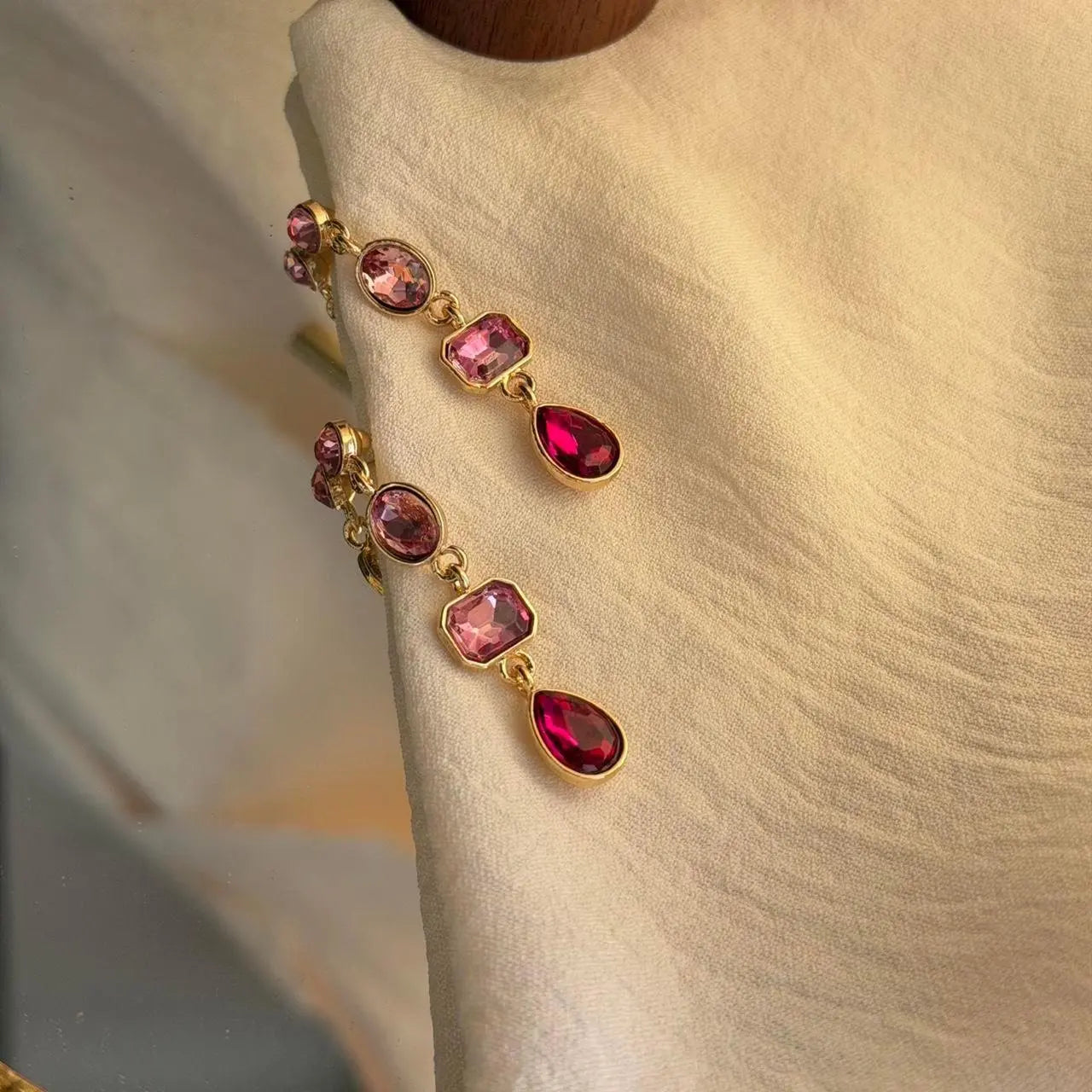 Pink Ombre Crystal Triple Cascade Drop Earrings Gold — worn on model, side profile