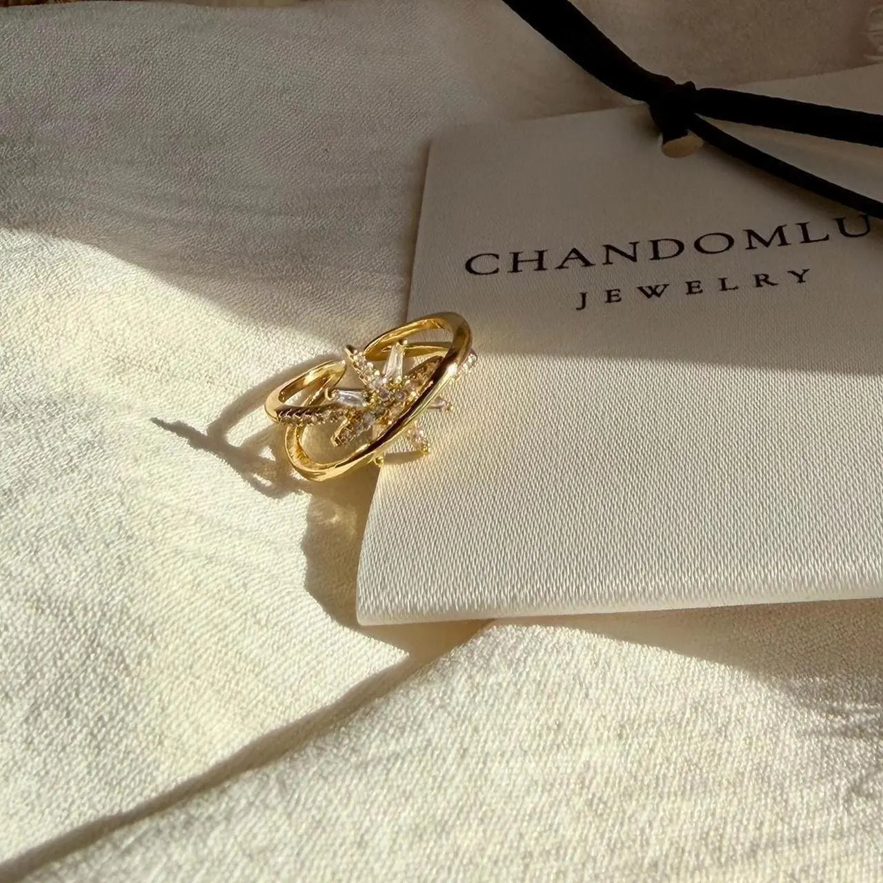 Crystal Pavé Leaf Star Open Ring 14K Gold Adjustable — worn on finger, angled view