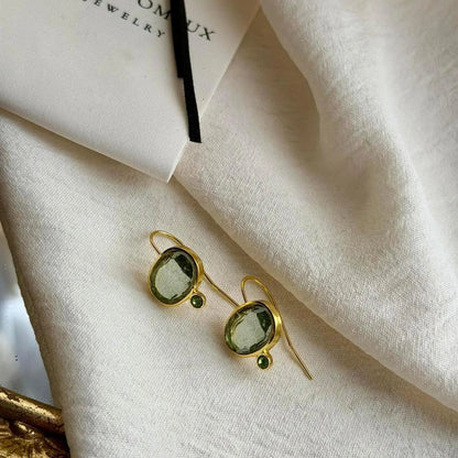 Grey Crystal & Green Accent Drop Earrings Gold — angle highlighting drop and movement