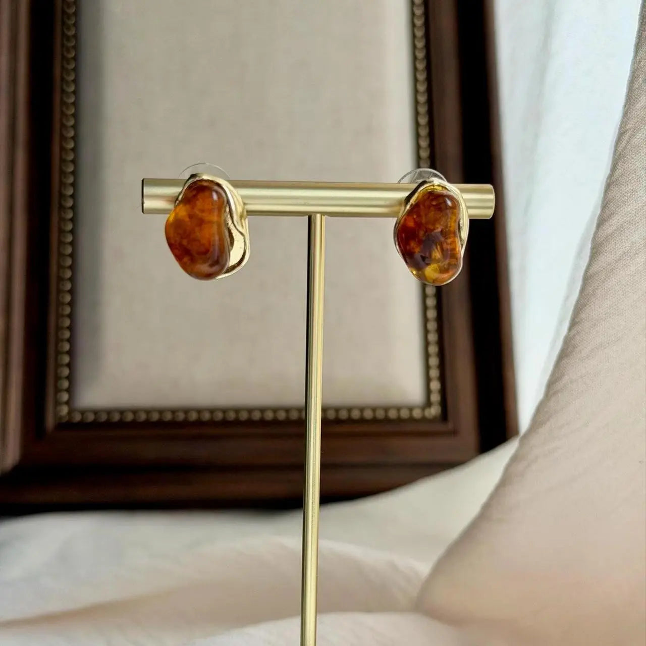 Organic Amber Resin Stud Earrings S925 Gold Wavy on neutral background — front view