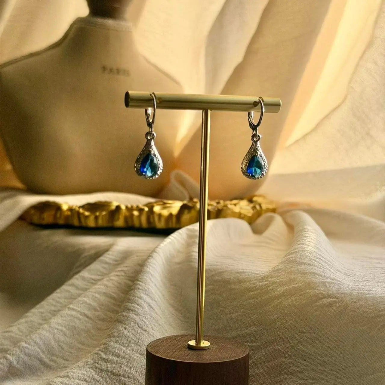 Sapphire Blue Crystal Teardrop Earrings Silver on neutral background — front view