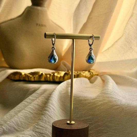 Sapphire Blue Crystal Teardrop Earrings Silver on neutral background — front view