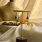Sapphire Blue Crystal Teardrop Earrings Silver on neutral background — front view