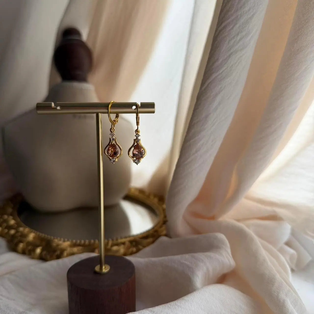 Peach Crystal Huggie Drop Earrings Gold Stainless — worn on model, side profile