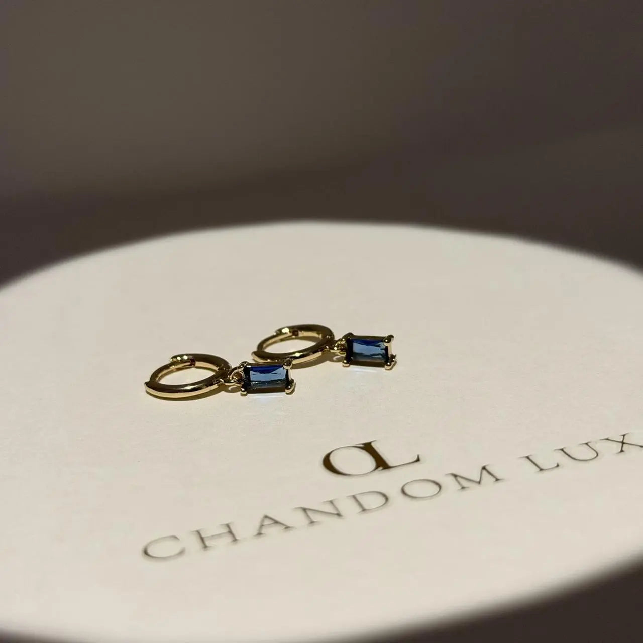 Baguette Blue Crystal Huggie Hoop Earrings 14K Gold — close-up of pearl and post detail