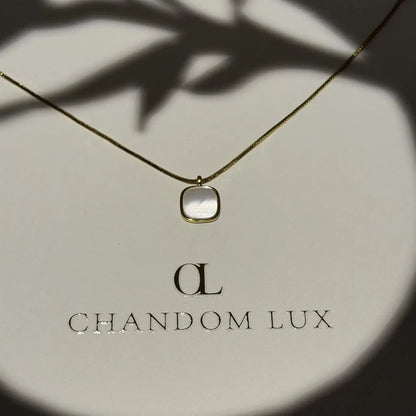 Mother of Pearl Cushion Pendant Necklace Gold Tone on neutral background — full length view