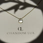 Mother of Pearl Cushion Pendant Necklace Gold Tone on neutral background — full length view