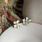 White Enamel 3D Flower Stud Earrings S925 Gold on neutral background — front view