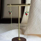 Multicolour Rhinestone Drop Earrings Gold Tone Women on neutral background — front view