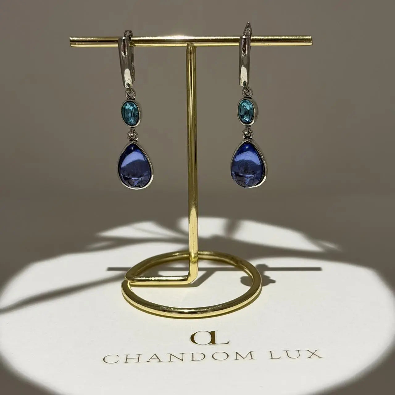 Teal & Blue Dual Crystal Drop Earrings Silver Tone on neutral background — front view