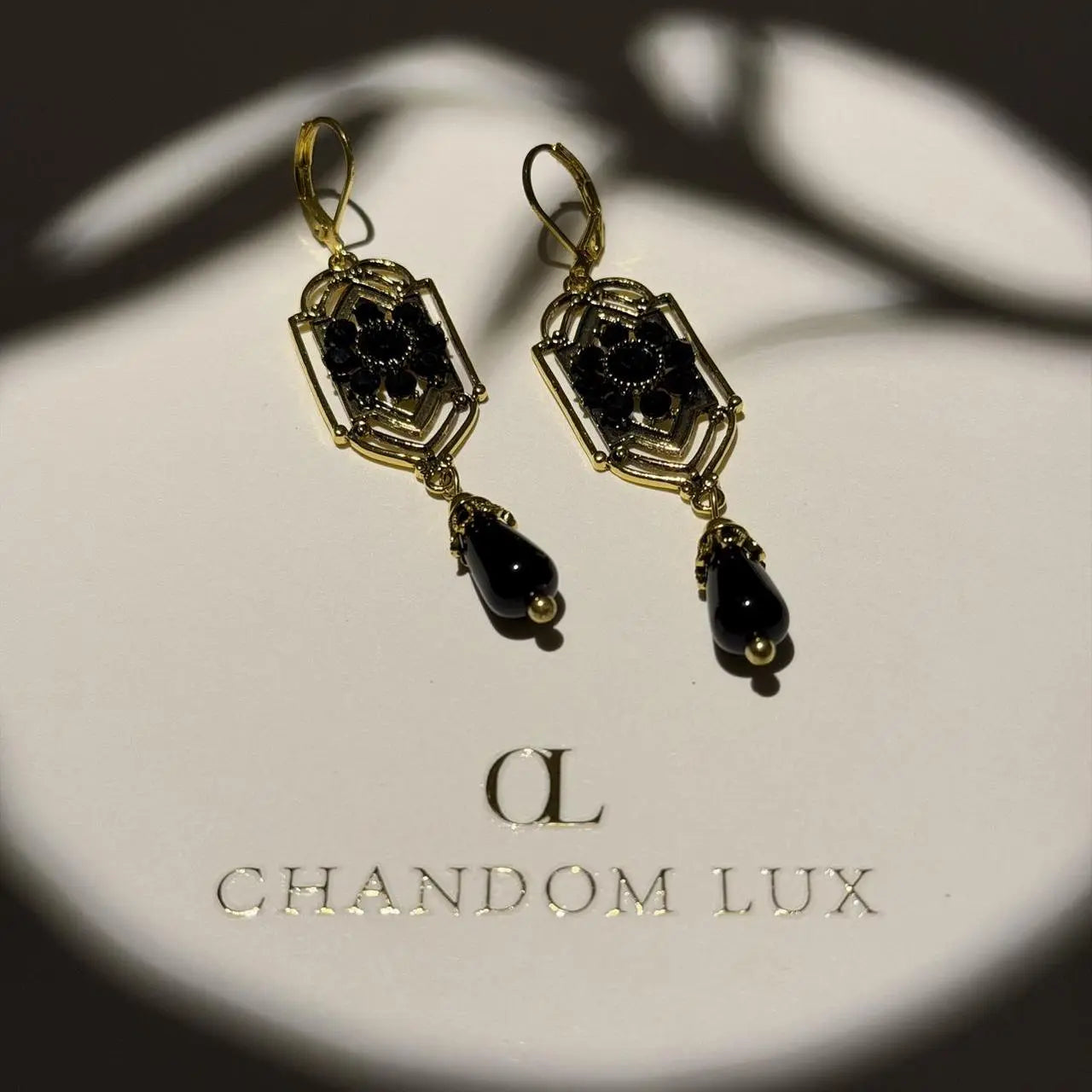 Art Deco Black Crystal Filigree Drop Earrings Gold — detail shot of gold tone