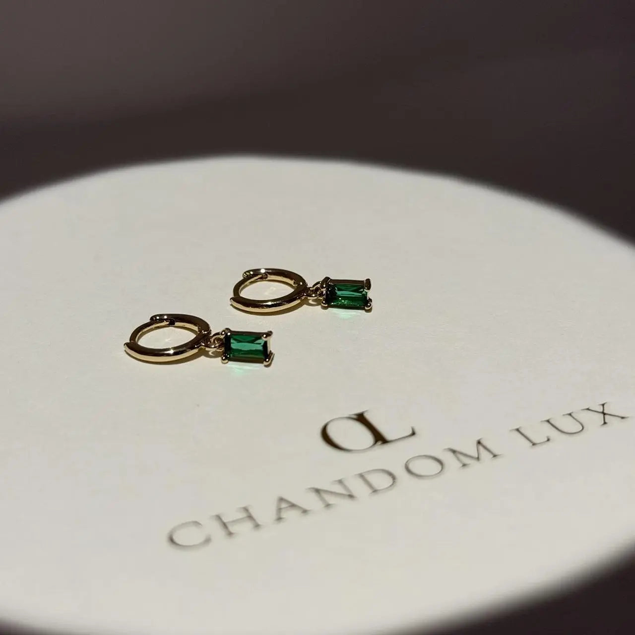 Emerald Baguette Crystal Huggie Hoop Earrings 14K — close-up of pearl and post detail