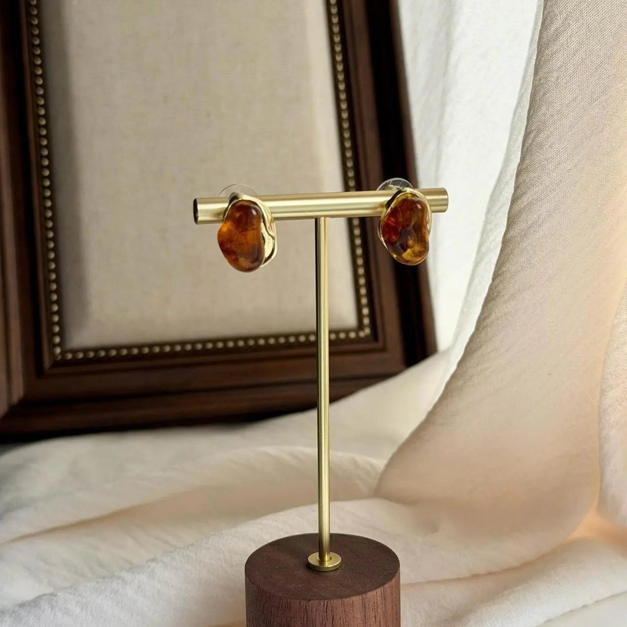 Organic Amber Resin Stud Earrings S925 Gold Wavy — worn on model, side profile