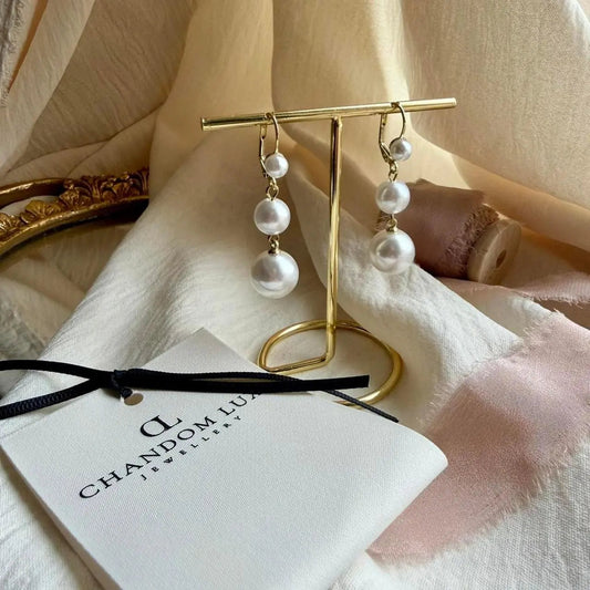 Triple Graduated Pearl Drop Earrings S925 Gold on neutral background — front view