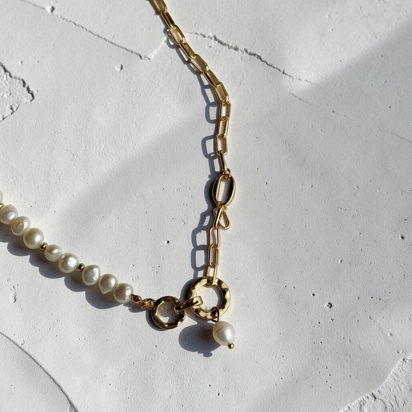 Freshwater Pearl Asymmetric Chain Necklace Gold — styled flat lay with textures
